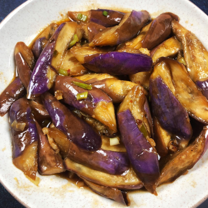 Premium Photo  Cook cuts the eggplant according to the recipe, on